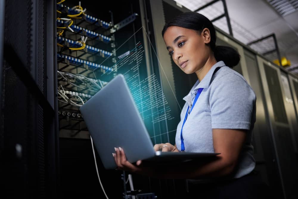 female technician working in a laptop.